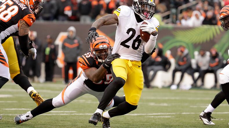 Bengals linebacker Vontaze Burfict, seen here tackling Steelers refugee/holdout running back Le'Veon Bell last season at Paul Brown Stadium on December 18, doesn't like Pittsburgh. Those folks don't like him much, either, apparently.