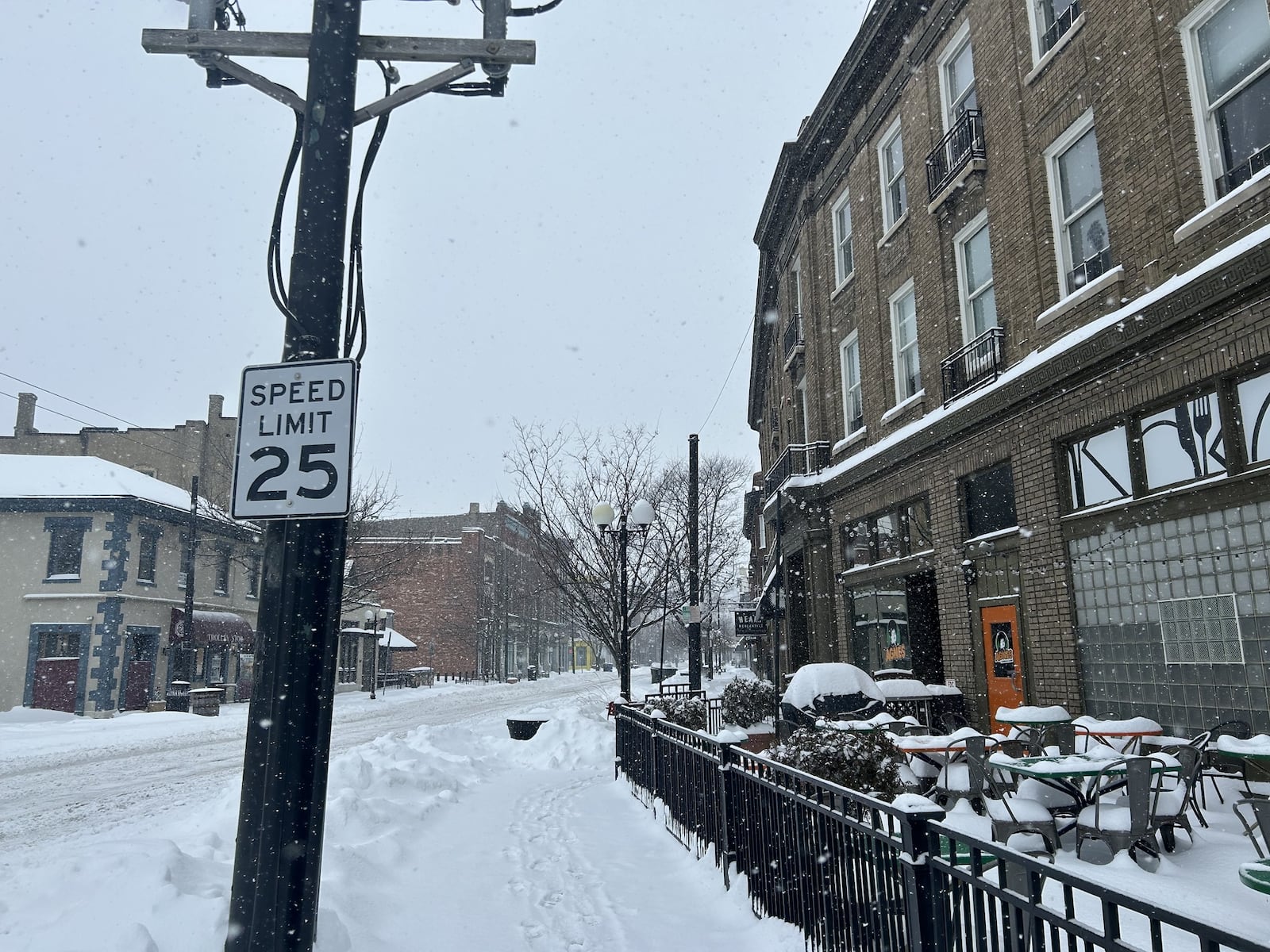 The Oregon District in Dayton is covered with snow. CONTRIBUTED