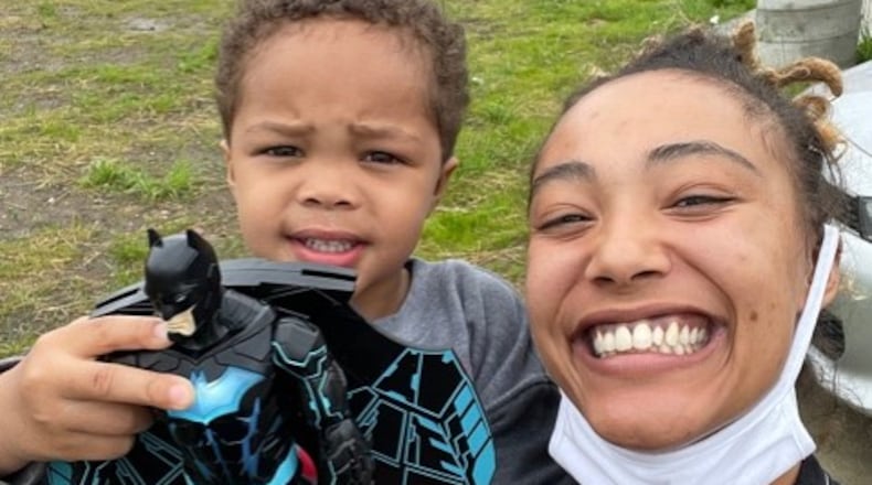 Elexus Renner, right, holds her son, Zavier Renner, 3, outside of the Gem City Market. Elexus Renner is being honored as a Community Gem. Courtesy of Elexus Renner.
