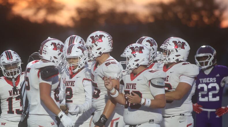 Wayne celebrates a touchdown by Isaiah Thompson (2) in the second quarter against Pickerington Central on Friday, Aug. 29, 2025, in Pickerington. David Jablonski/Staff