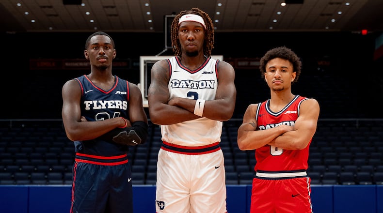 Dayton's Kobe Elvis, Jaiun Simon and Javon Bennett show off new uniforms ahead of the 2023-24 season at UD Arena. Photo courtesy of UD
