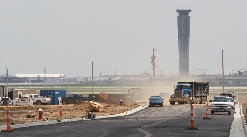 A truck turns into the Prologis distribution center construction site off a new section of Jackson Road at Union Global Logistics Airpark near Dayton International Airport. CHRIS STEWART / STAFF