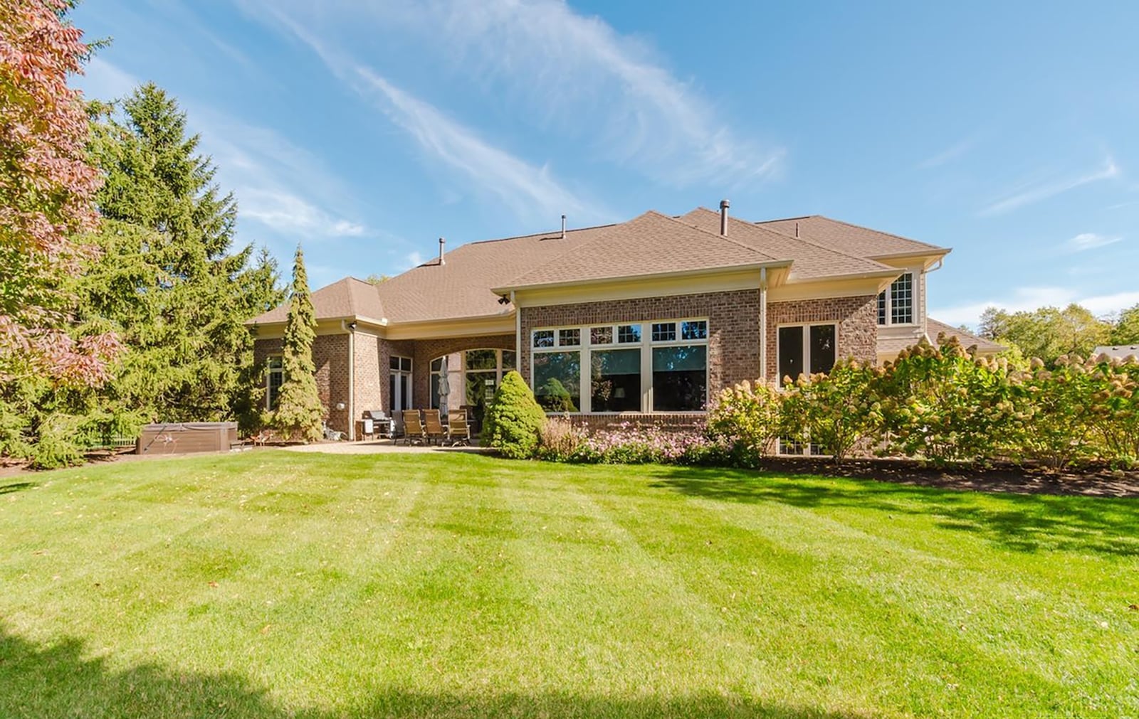 The back yard is fully fenced and the rear paver patio is partially covered. There is also a hot tub. CONTRIBUTED