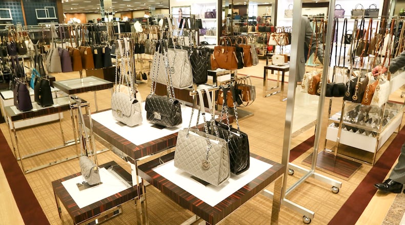 Michael Kors designed purses on display during a media preview for the new 2 floor, 160,000-square-foot Dillard’s store at Liberty Center, Wednesday, Sept. 30, 2015. GREG LYNCH / STAFF