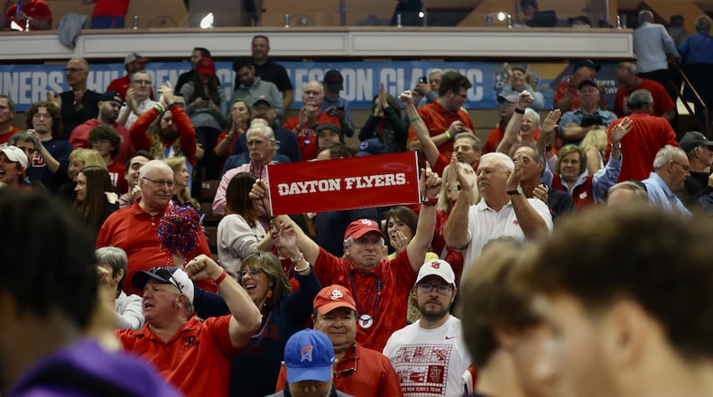 Dayton fans celebrate a victory against LSU in the first round of the Charleston Classic on Thursday, Nov. 16, 2023, at TD Arena in Charleston, S.C. David Jablonski/Staff