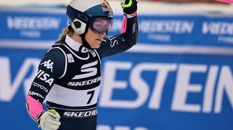 United States' Lindsey Vonn celebrates at the finish area of an alpine ski, women's World Cup Super G, in Tarvisio, Italy, Sunday, Jan. 18, 2026. (AP Photo/Marco Trovati)