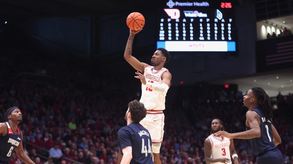 Dayton's Bryce Heard scores against Duquesne on Saturday, Feb. 21, 2026, at UD Arena. David Jablonski/Staff