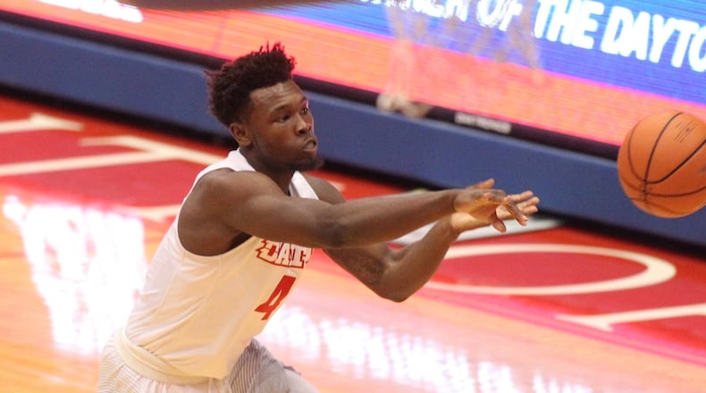 Dayton’s Jordan Davis passes against Ball State on Friday, Nov. 10, 2017, at UD Arena. David Jablonski/Staff