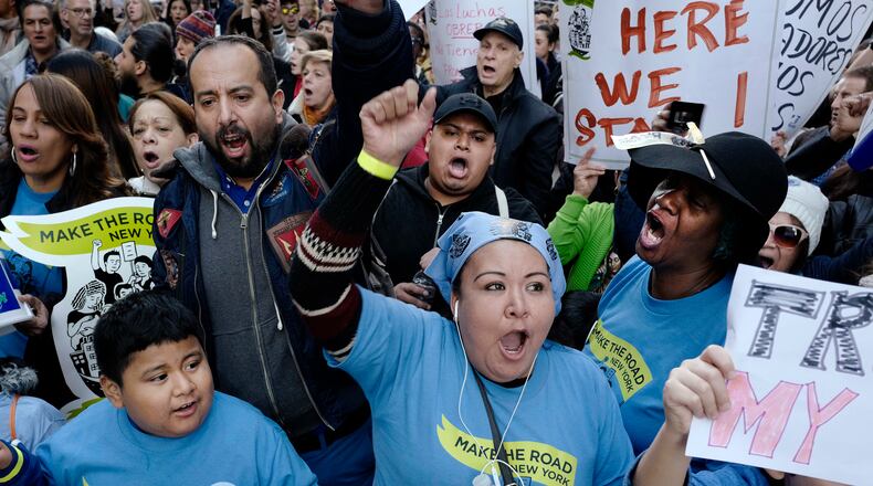 Immigrants and supporters protest against President-elect Donald Trump during a march, Sunday, Nov. 13, 2016, in New York. Immigrants and their advocates added their voices on Sunday to those who have been marching and protesting Donald Trump's presidential win. Organizers said the protest scheduled for Sunday mid-afternoon in Manhattan is about speaking out against Trump's support of deportation and other measures. (AP Photo/Mark Lennihan)