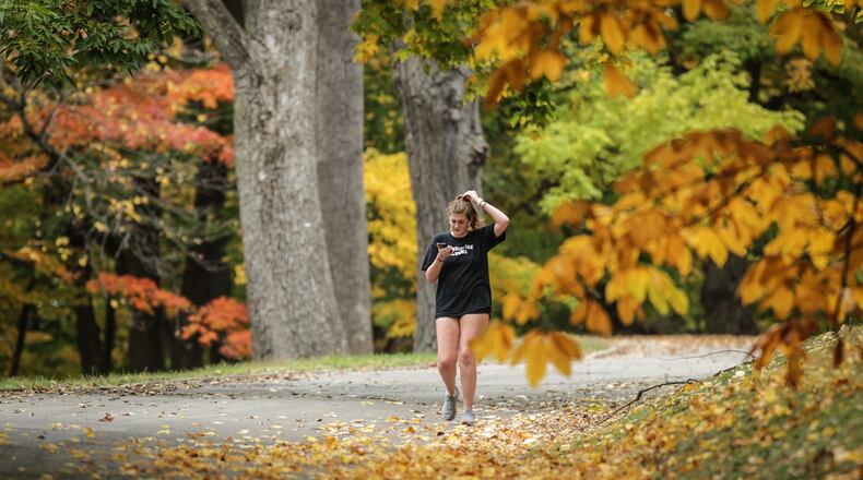 A warm weekend and week may bring our first frost of the season this coming weekend. The University of Dayton student Abby Medler runs through Woodland Cemetery Monday October 12.