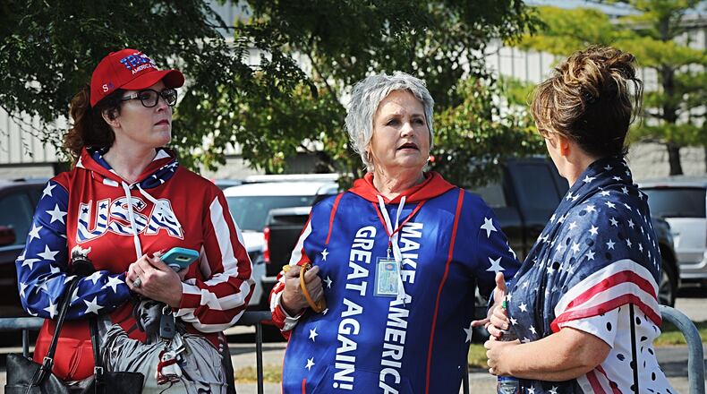 Trump supporters lineup outside near Dayton International Airport Monday morning. MARSHALL GORBY\STAFF