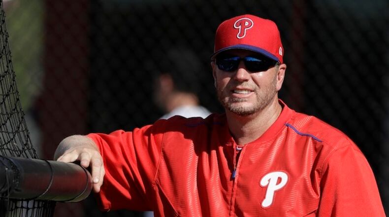 FILE - In this March 9, 2017, file photo, guest instructor, former Philadelphia Phillies pitcher Roy Halladay watches relief pitcher Joaquin Benoit throw live batting practice during a workout in Clearwater, Fla. Authorities have confirmed that former Major League Baseball pitcher Roy Halladay died in a small plane crash in the Gulf of Mexico off the coast of Florida, Tuesday, Nov. 7, 2017. (AP Photo/Chris O'Meara, File)