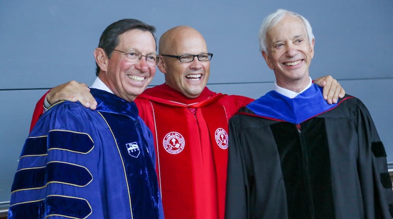 Miami University President Gregory Crawford, center, stands with former presidents David Hodge and James Garland during his inauguration ceremony Oct. 10 at Millett Hall in Oxford. GREG LYNCH / STAFF