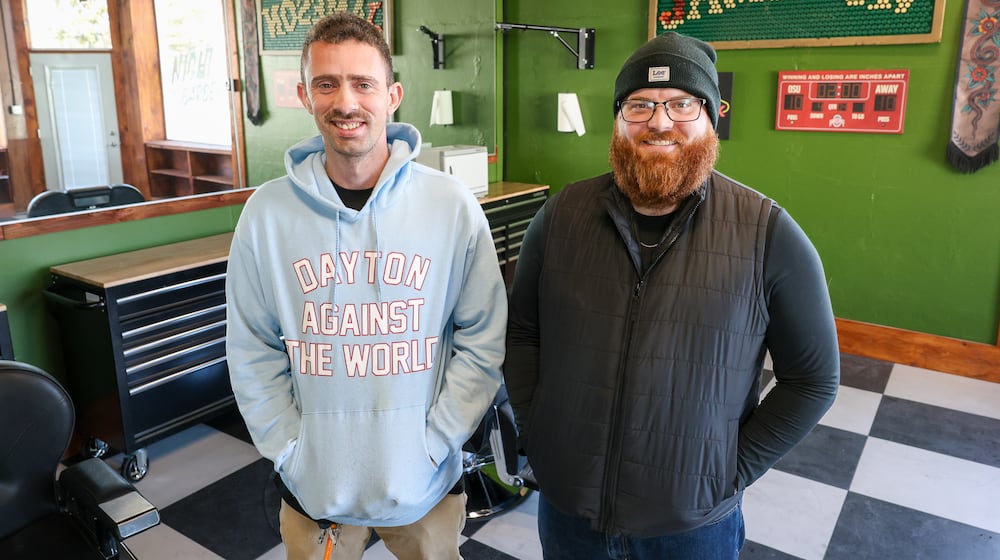 Khaliel Dailey (left) and Garrett Mendenhall pose at Night Owl Barber Company. The new business is set to open at 130 N. First St., Miamisburg on Saturday, Dec. 13. BRYANT BILLING/STAFF