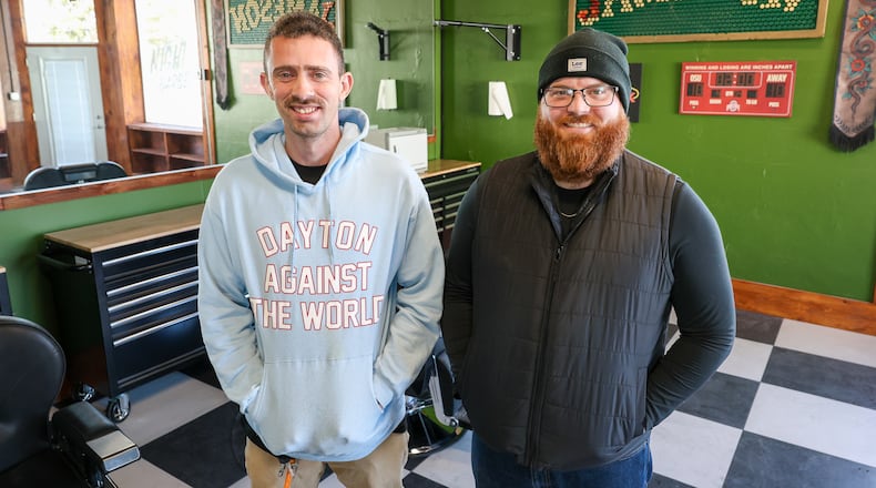 Khaliel Dailey (left) and Garrett Mendenhall pose at Night Owl Barber Company. The new business is set to open at 130 N. First St., Miamisburg on Saturday, Dec. 13. BRYANT BILLING/STAFF
