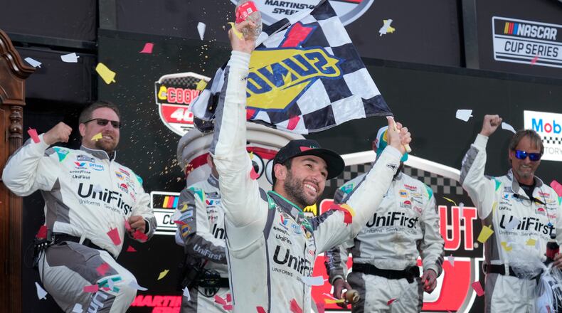 Chase Elliott celebrates in Victory Lane after winning a NASCAR Cup Series auto race in Martinsville, Va., Sunday, March 29, 2026. (AP Photo/Chuck Burton)