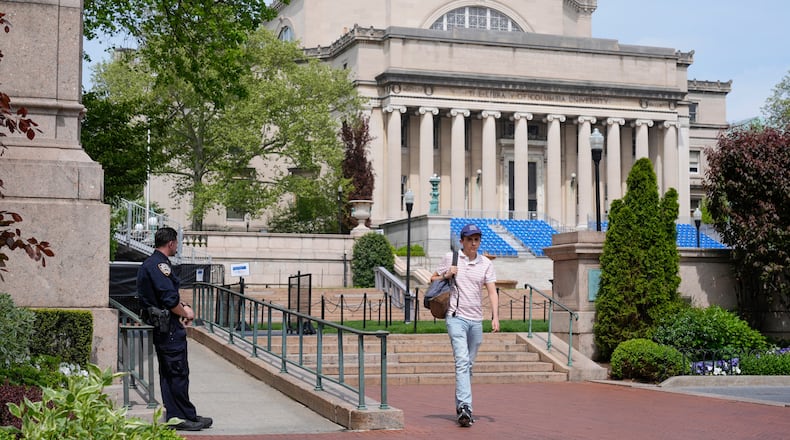 FILE - A New York City police officer keeps watch on the campus of Columbia University in New York, May 6, 2024. (AP Photo/Seth Wenig, File)