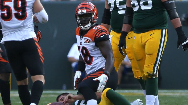 GREEN BAY, WI - SEPTEMBER 24: Carl Lawson #58 of the Cincinnati Bengals sacks Aaron Rodgers #12 of the Green Bay Packers during the third quarter of their game at Lambeau Field on September 24, 2017 in Green Bay, Wisconsin. (Photo by Dylan Buell/Getty Images)