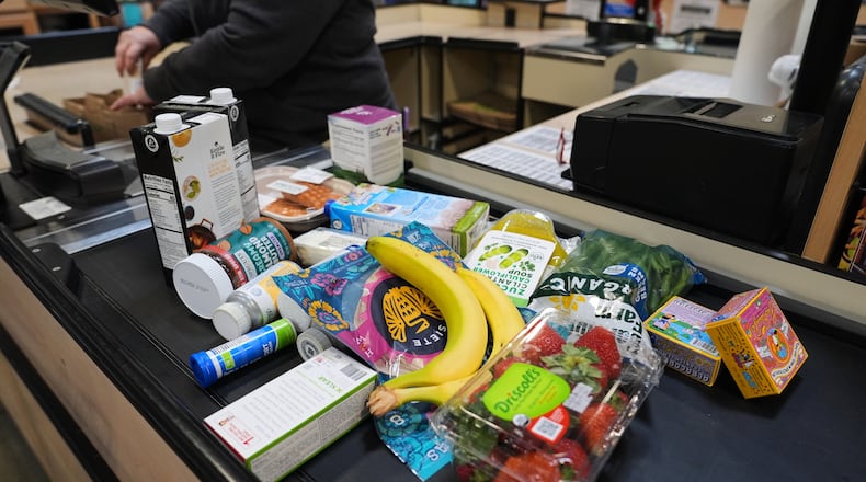 A cashier scans groceries, including produce, which is covered by the USDA Supplemental Nutrition Assistance Program (SNAP), at a grocery store in Baltimore, Monday, Nov. 10, 2025. (AP Photo/Stephanie Scarbrough)