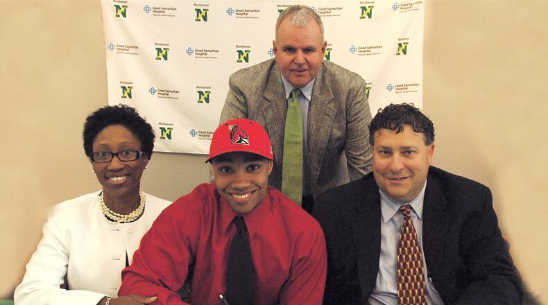 Northmont High School's Blake Beemer recently signed a letter of intent to play baseball for Ball State University. Joining Blake at the ceremony were his mother, Elizabeth, and father, Greg. Standing is Northmont baseball coach Chuck Harlow. Beemer was a first-team All-GWOC selection at first base. He batted .422 to help the Thunderbolts finish the season with a 23-7 record.