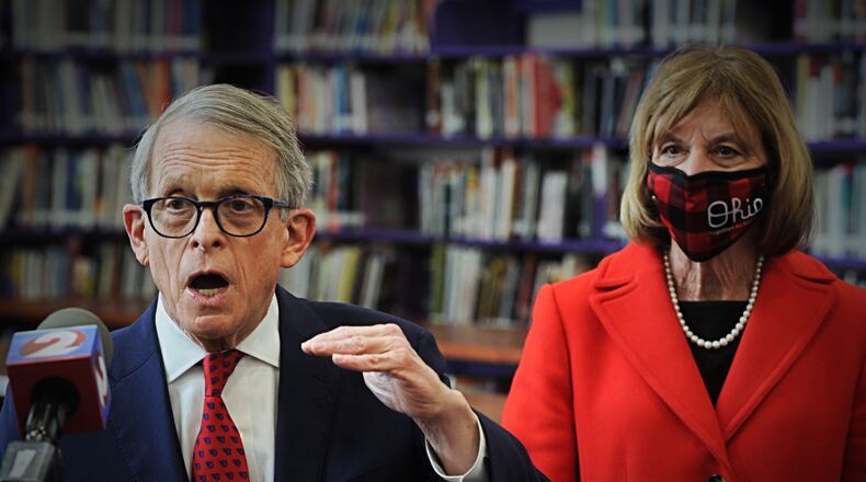 Gov. Mike DeWine addresses the media after touring a COVID-19 vaccination clinic at Thurgood Marshall High school in Dayton. Staff photo by Marshall Gorby