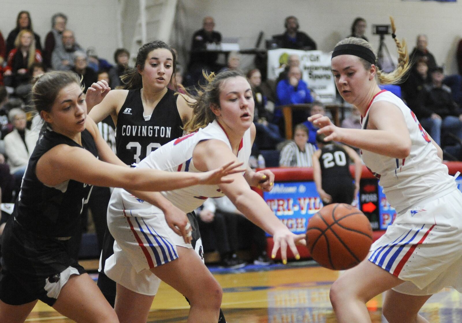 Sisters Meghan (center) and Maddie Downing (right) are the Tri-Village “Twin Towers.” Tri-Village defeated visiting Covington 44-35 in a girls high school basketball game on Thursday, Jan. 10, 2019. MARC PENDLETON / STAFF