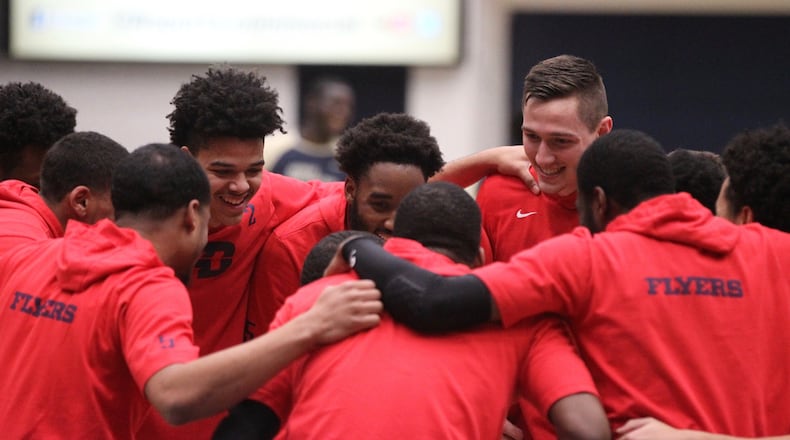 Dayton huddles before a game against George Washington on Wednesday, Jan. 9, 2019, at the Charles E. Smith Center in Washington, D.C. David Jablonski/Staff