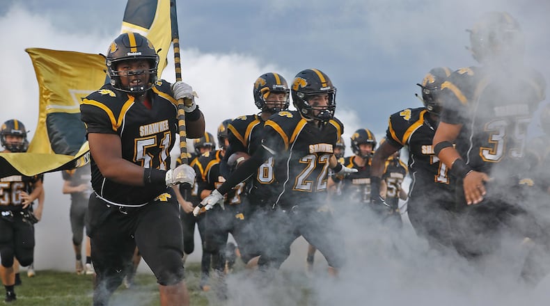 The Shawnee Braves take the field Friday night against Kenton Ridge. Bill Lackey/Staff