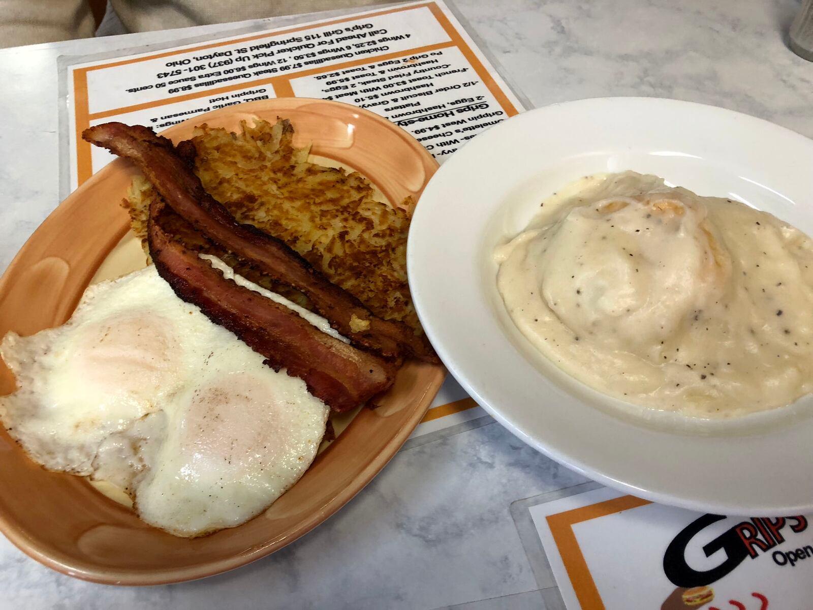 Grips Grill and Diner is located at  15 Springfield St. in Dayton. The Get a Grip  - two eggs, hash browns,  meat, and biscuit and gravy - is pictured.