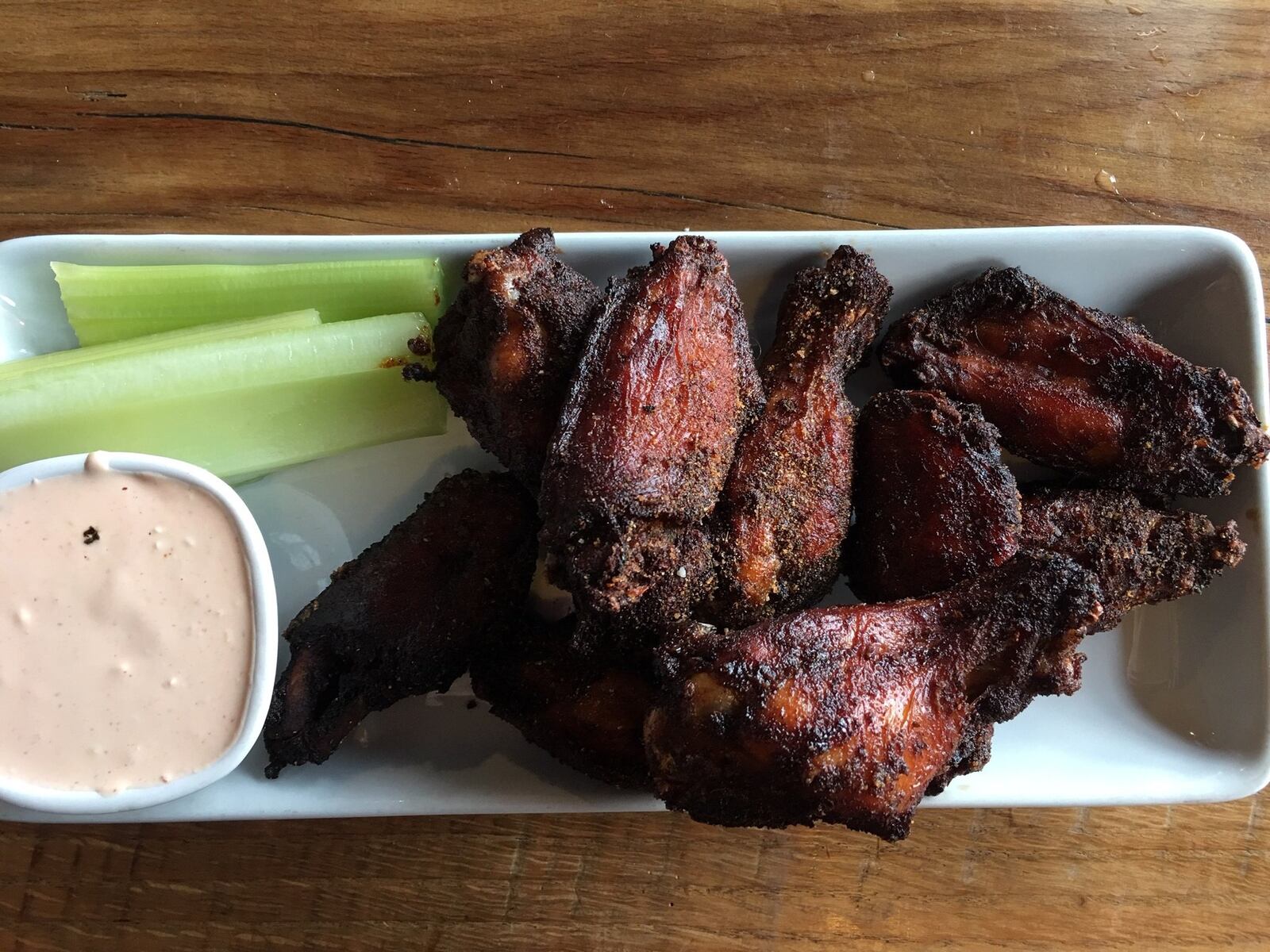 Lock 27’s signature dry rubbed, house smoked chicken wings, served with celery and house made Sriracha blue cheese, come two ways — a hot habanero-peach rub or a dry sweet and spicy rub. CONTRIBUTED/ALEXIS LARSEN