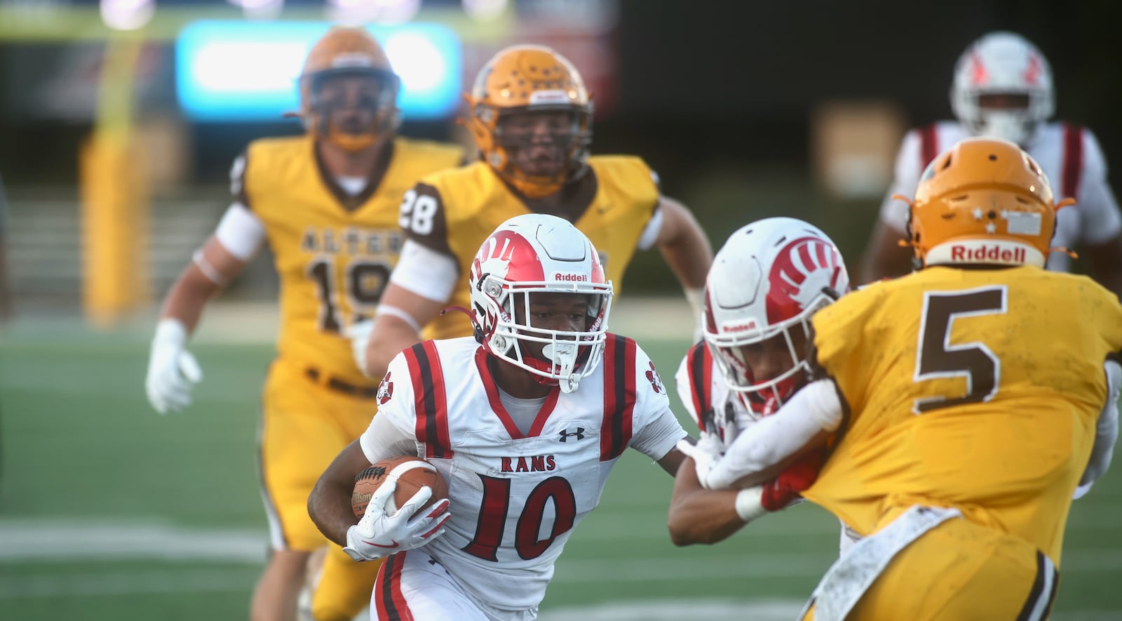 Trotwood-Madison's Daylan Dennis runs against Alter on Friday, Sept. 12, 2025, at Roush Stadium in Kettering. David Jablonski/Staff