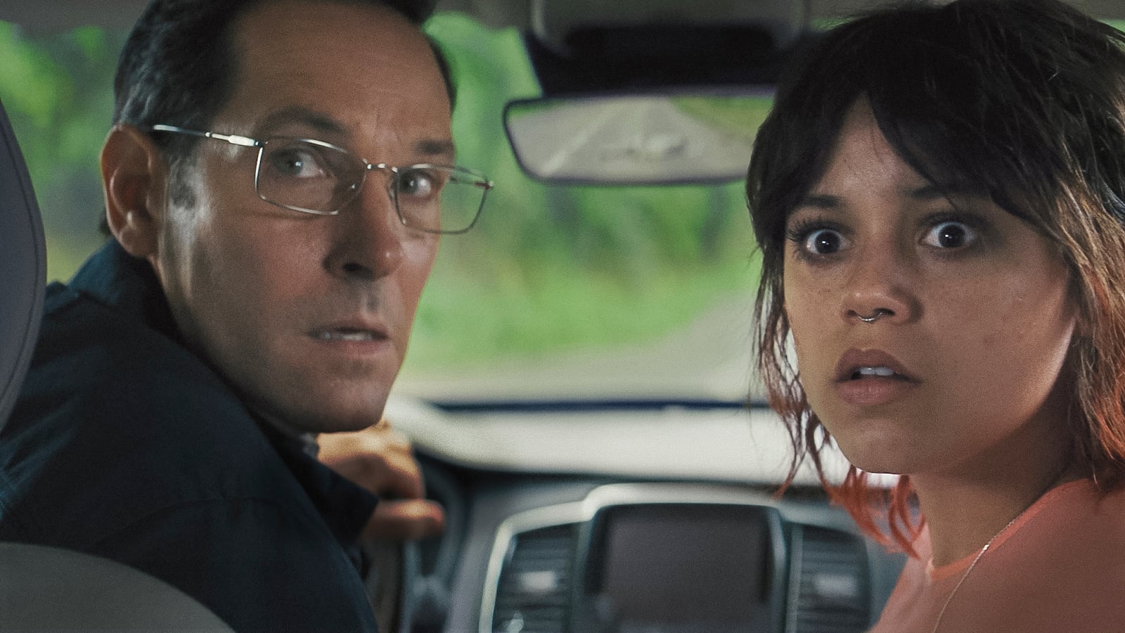 This image released by A24 shows Paul Rudd, left, and Jenna Ortega in a scene from "Death of a Unicorn." (A24 via AP)