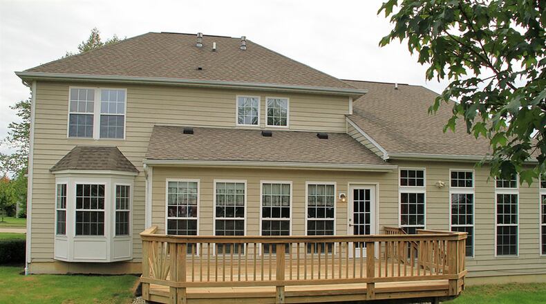 A door off the morning room opens to a wooden deck. Both the morning room and the great room have walls of windows to allow plenty of natural light into the home.