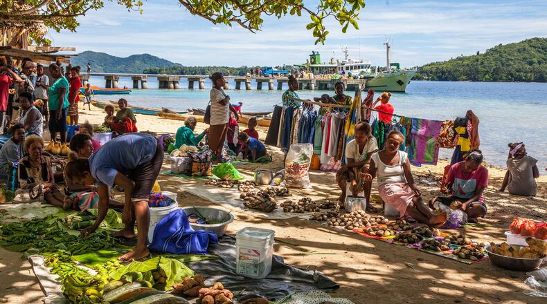 Market day on Marapa Island brings regional families together to buy, sell and visit. (Steve Haggerty/ColorWorld/TNS)