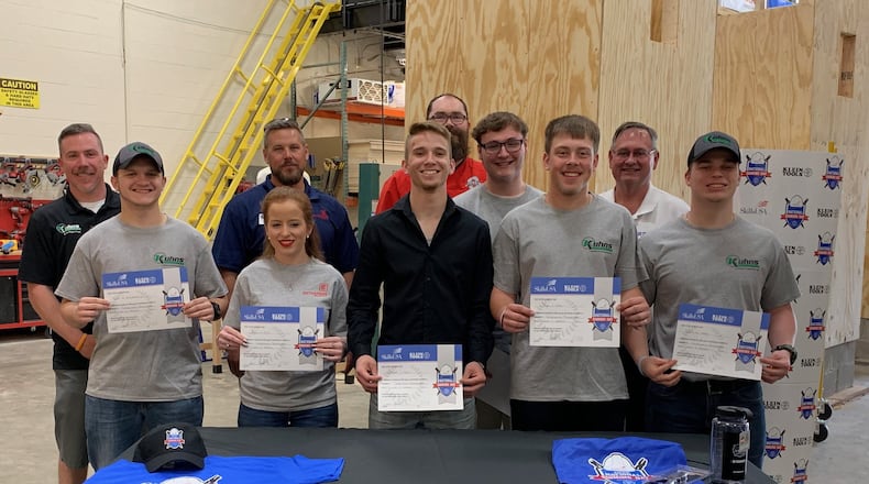Six Stebbins High School graduates participate in a Signing Day ceremony with the construction contractors they’re going to work for. The students are (front row, from left) Tyler Blankenship, Kayla Ellis, Connor Delili, Ryan Hiles and Devin Hasty; along with Austin Perkins (middle row, glasses). Behind them are Stebbins construction teacher Jeremy McGhee (back middle) and representatives of Kuhns Group, Enterprise Roofing and Ferguson Construction. CONTRIBUTED