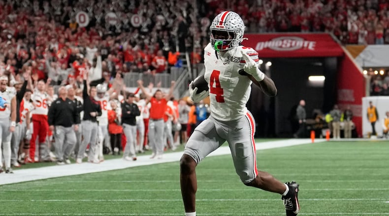 Ohio State wide receiver Jeremiah Smith runs for a touchdown against Notre Dame during first half of the College Football Playoff national championship game Monday, Jan. 20, 2025, in Atlanta. (AP Photo/Brynn Anderson)