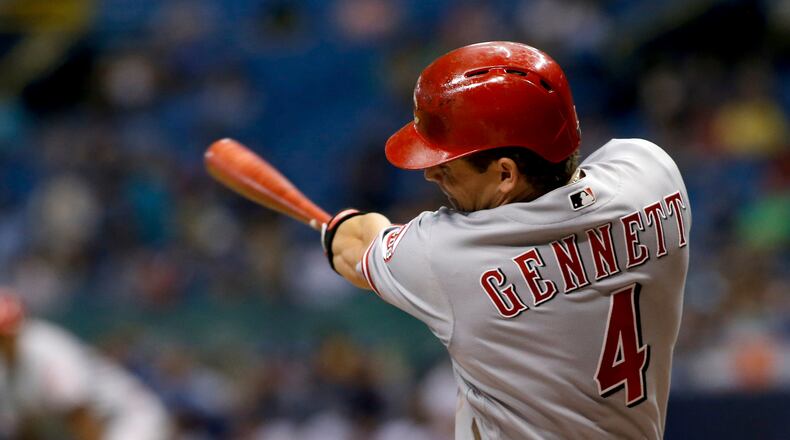 Scooter Gennett #4 of the Cincinnati Reds follows through on his swing after hitting a two-run home run off of pitcher Jake Odorizzi of the Tampa Bay Rays during the sixth inning of a game on June 19, 2017, at Tropicana Field in St. Petersburg, Fla.