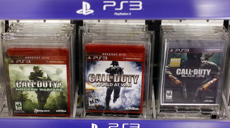 FILE - Three versions of Activision's Call Of Duty games are seen on sale at Best Buy in Mountain View, Calif., Wednesday, Aug. 3, 2011. Vincent Zampella, one of the creators behind such best-selling video games "Call of Duty," has died at 55. (AP Photo/Paul Sakuma,File)