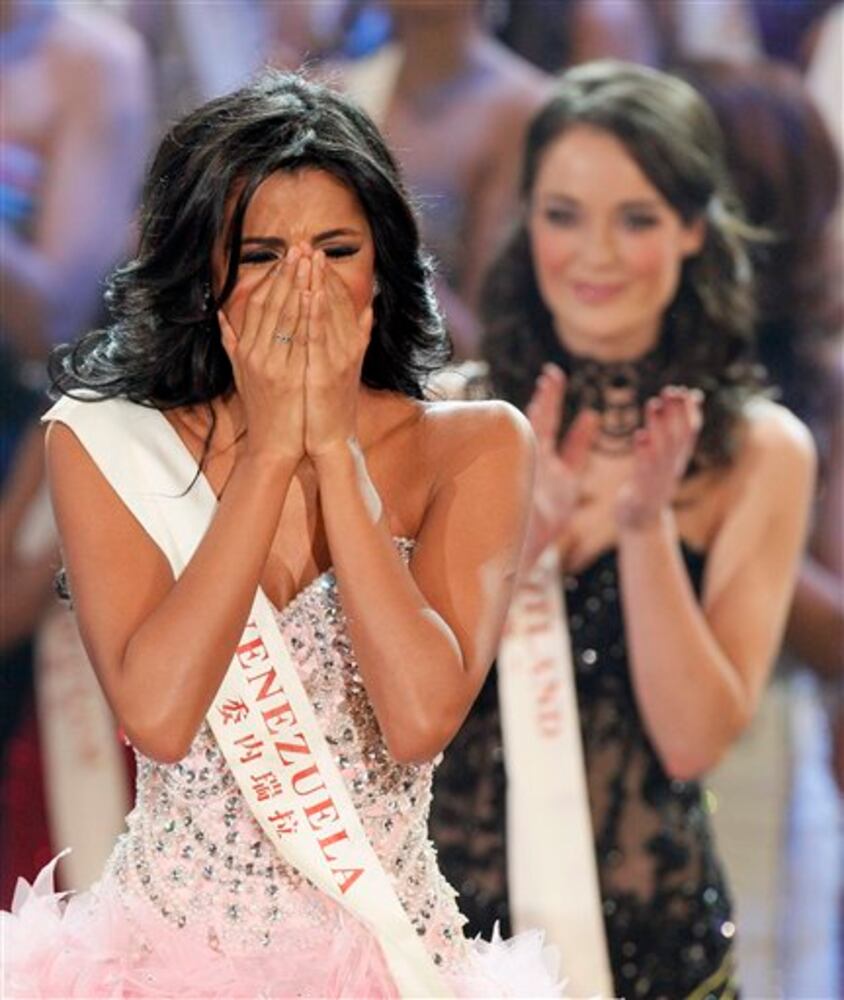 Miss Venezuela Ivian Sarcos reacts as she is announced winner