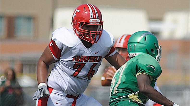 Fairfield offensive lineman Jackson Carman (left) takes out a Northmont defender on Sept. 5, 2015. MARC PENDLETON/STAFF
