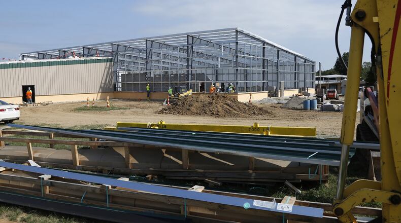 The new Greene County Parks and Trails building is going up fast at Deer Creek and Progress Drives in Xenia. The Greene County Commission approved a $4.8 million contract for the new facility which will consolidate operations from three separate facilities to this one. TY GREENLEES / STAFF