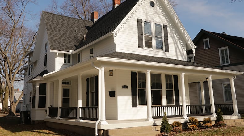 The totally renovated farmhouse, with about 2,040 sq. ft. of living space, offers 4 bedrooms, 3 full bathrooms, a spacious kitchen, living room, dining room and family room. The exterior has a new room with gingerbread trim and a wrap-around covered front porch. CONTRIBUTED PHOTO BY KATHY TYLER