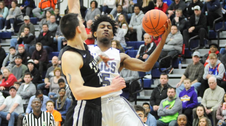Xenia’s Samari Curtis (shooting), shown here in Flyin’ to the Hoop, scored a school-record 52 points in Tuesday’s defeat of Bellefontaine. MARC PENDLETON / STAFF