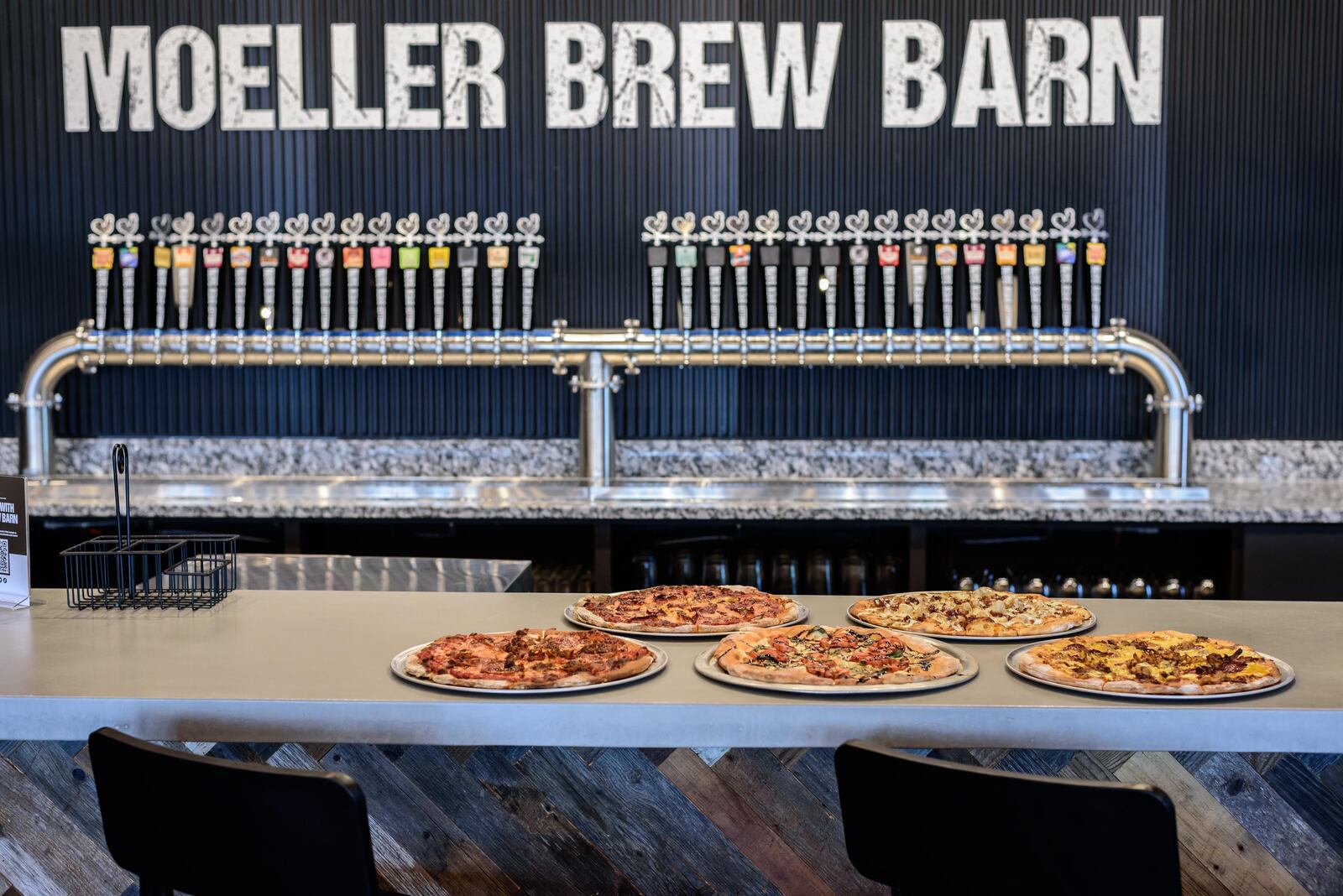 Here's a sneak peek at the new Moeller Brew Barn, located at 416 E. 1st St. in downtown Dayton. The taproom will open its doors with a grand opening celebration on Friday, Aug. 19, 2022 at 11 a.m. TOM GILLIAM / CONTRIBUTING PHOTOGRAPHER