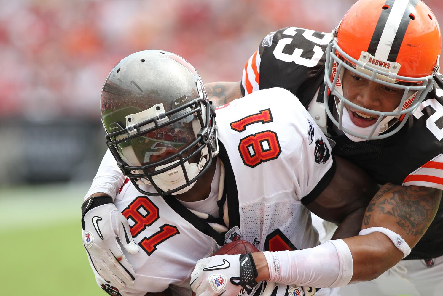 Buccaneers wide receiver Micheal Spurlock (81) catches the ball for a touchdown as Cleveland Browns cornerback Joe Haden (23) defends.