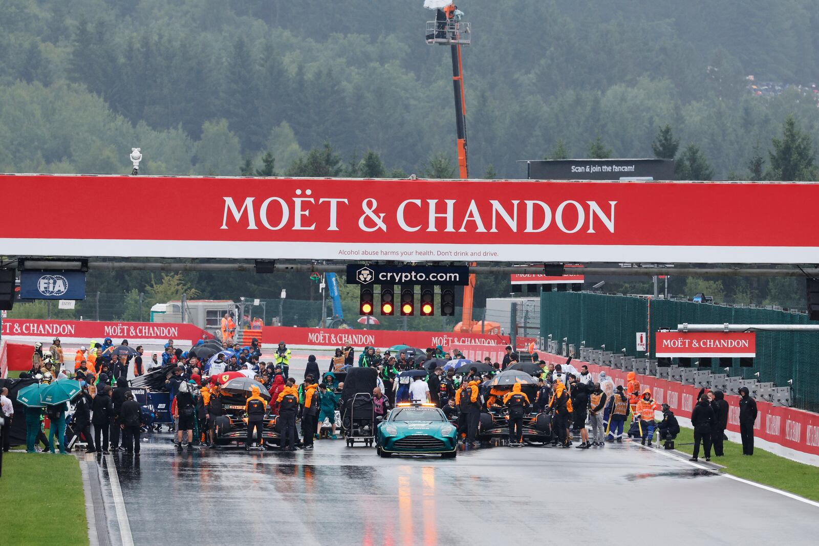 Cars begin to line up on the grid prior to the start of the Formula One Grand Prix at the Spa-Francorchamps racetrack in Spa, Belgium, Sunday, July 27, 2025. (AP Photo/Geert Vanden Wijngaert)