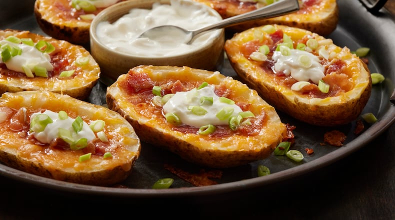 Crispy, cheesy and packed with smoky bacon, potato skins are a popular sports watching appetizer snack. ISTOCK PHOTO