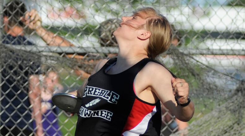 Preble Shawnee sophomore Megan Roell competes in the discus during the first day of the SWBL track and field meet at Northridge last season. MARC PENDLETON / STAFF