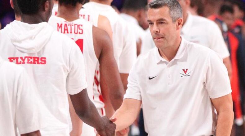 Dayton players shake hands with Virginia coach Tony Bennett after a game on Thursday, Nov. 22, 2018, at Imperial Gym on Paradise Island, Bahamas.