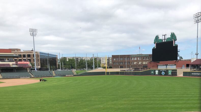 A groundskeeper mows the field at Day Air Ballpark earlier this week. Marc Katz/CONTRIBUTED